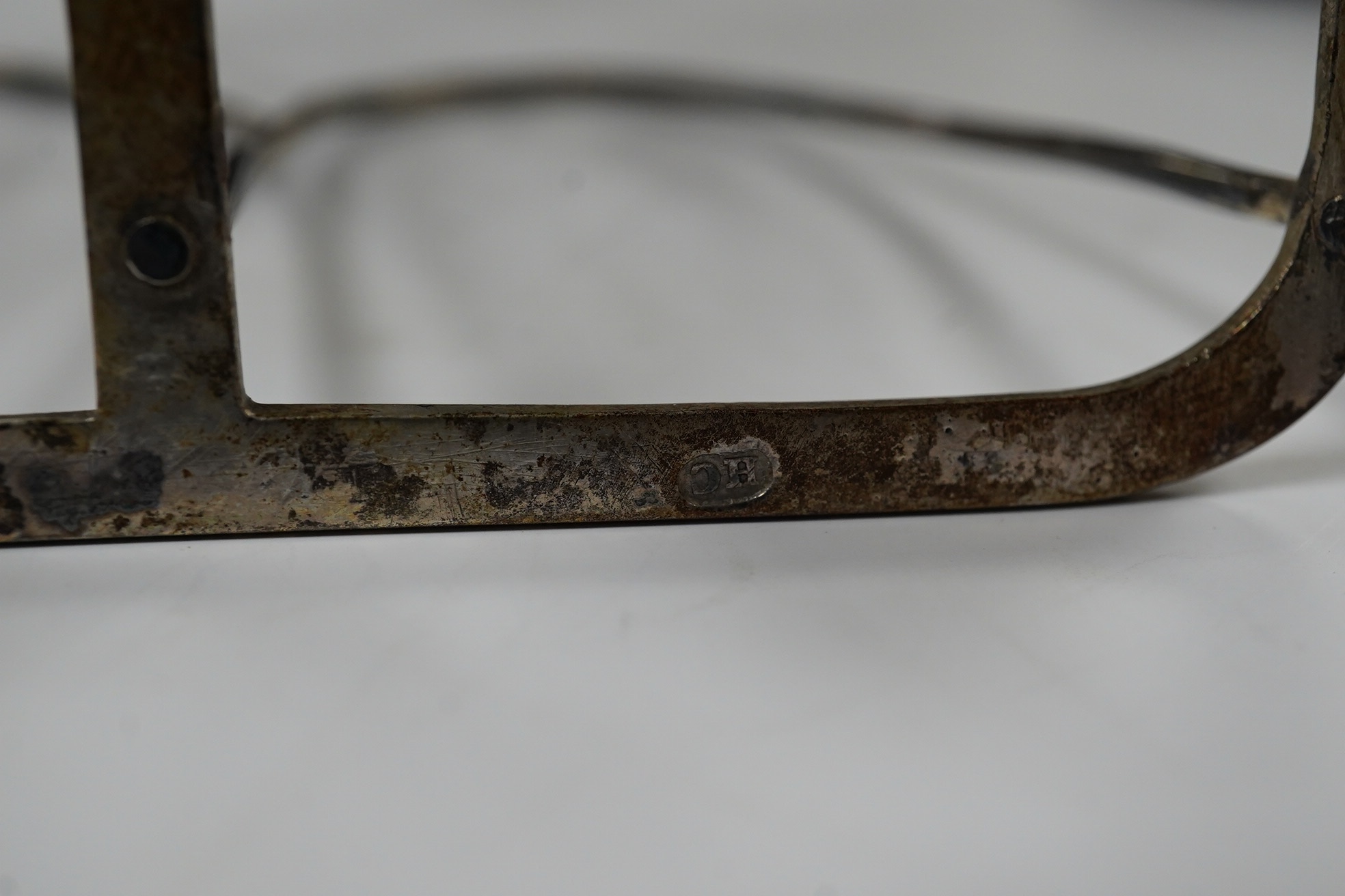A George III silver seven bar toast rack, by Henry Chawner, London, 1795, with ring handle, length 14.7cm, 5.8oz. Condition - fair
